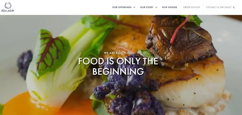 Blue Plate Catering's website featuring a close-up image of a dish and "Food is only the beginning" display text.